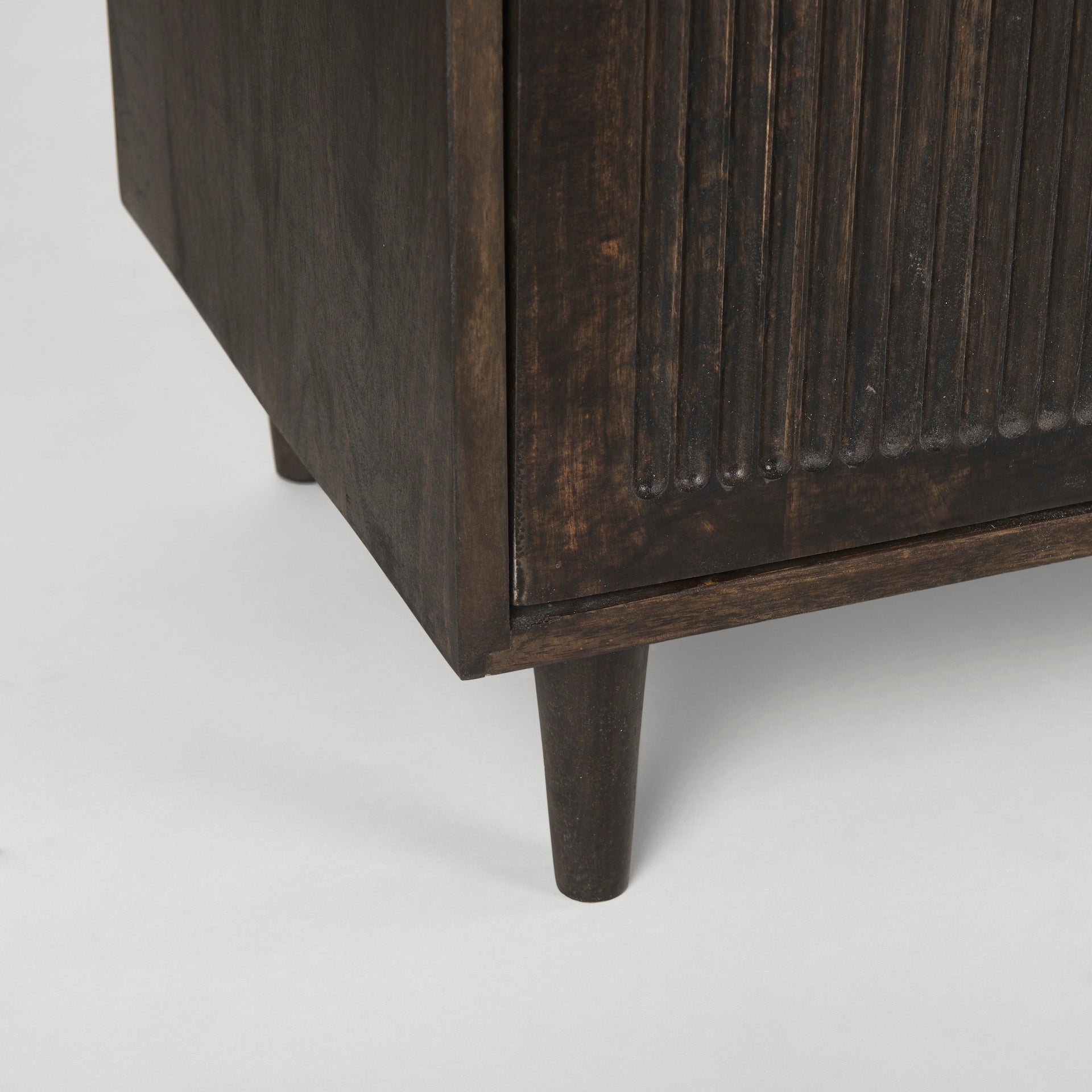 Close up of Tucker Dark Brown w/ Carved Arch Pattern 4 Door Sideboard on a white background