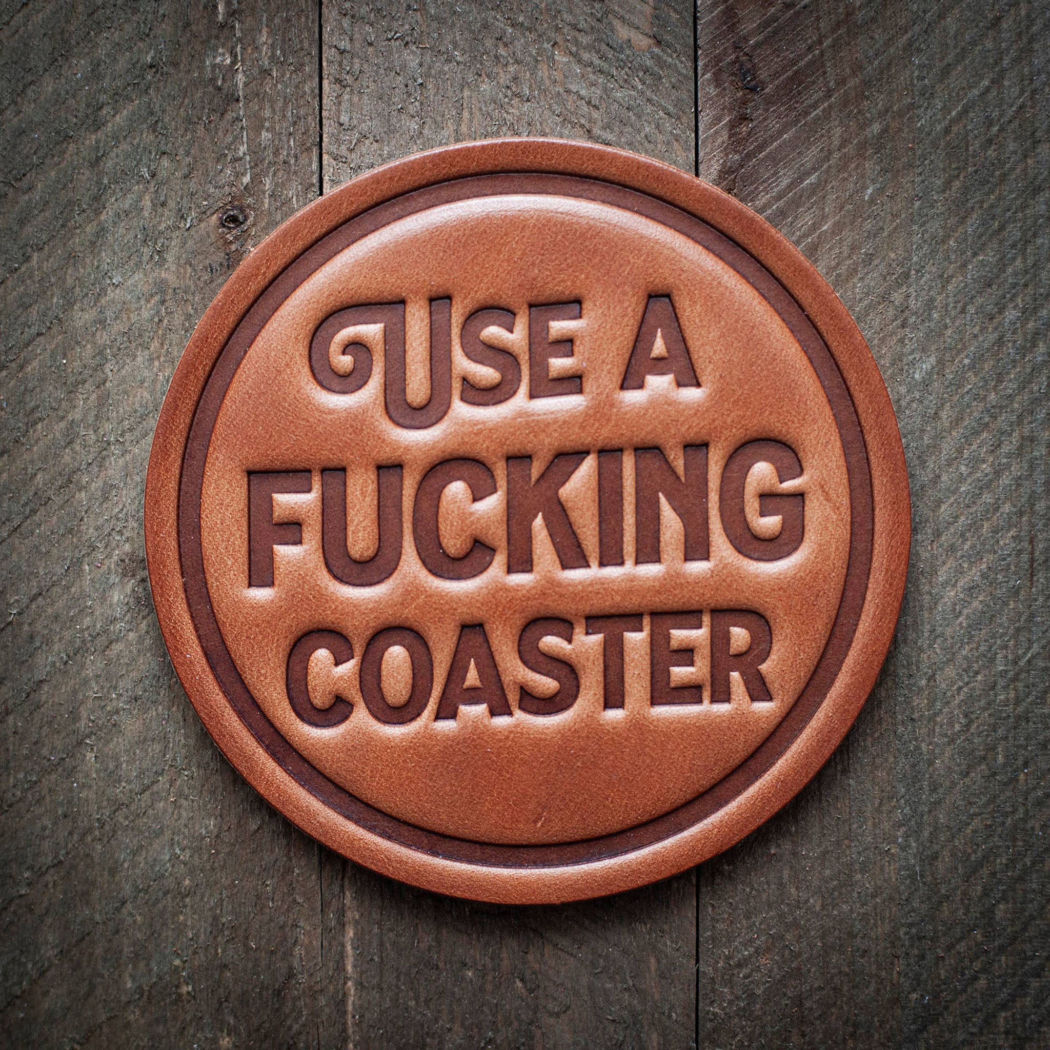 Use a F*cking Coaster Leather Coaster on a wood surface