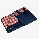 Red and White Check Outdoor Picnic Blanket with navy blue backside on a white background