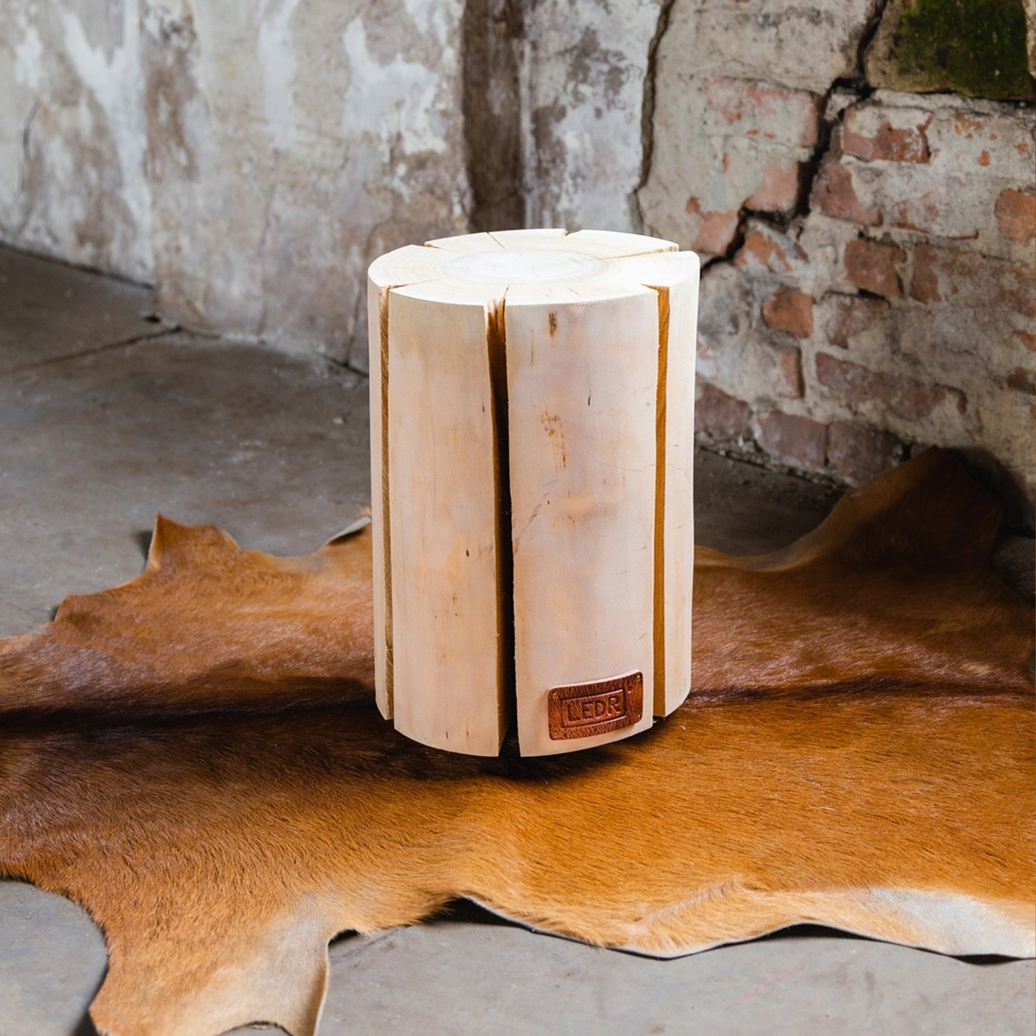 Large Cherry Trunk Light with Leather Strap on a hide rug at Addison West