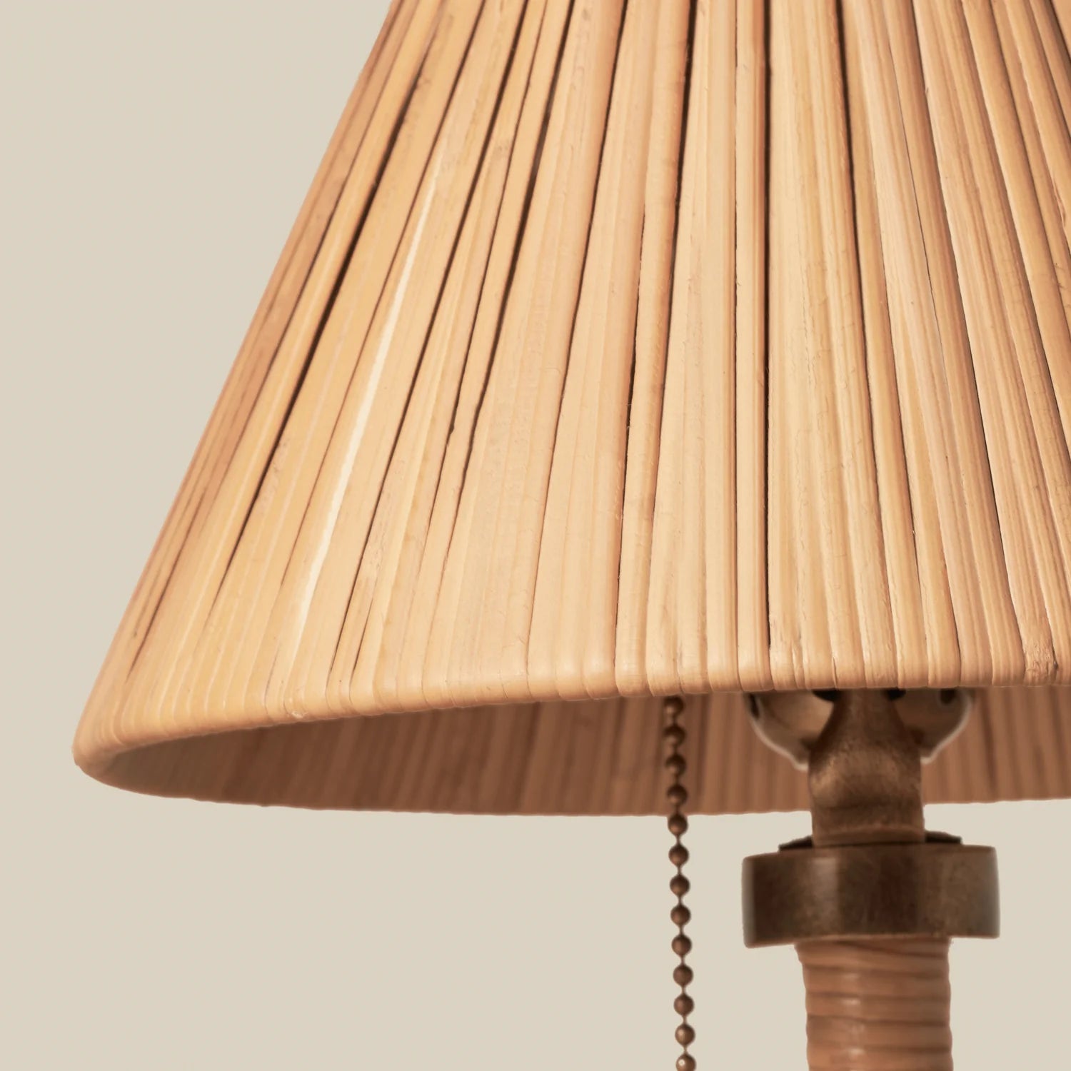 Close up of Woven Delphine Mini Table Lamp on a beige background at Addison West