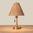 Woven Delphine Mini Table Lamp on a wood table at Addison West