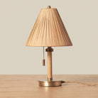 Woven Delphine Mini Table Lamp on a wood table at Addison West