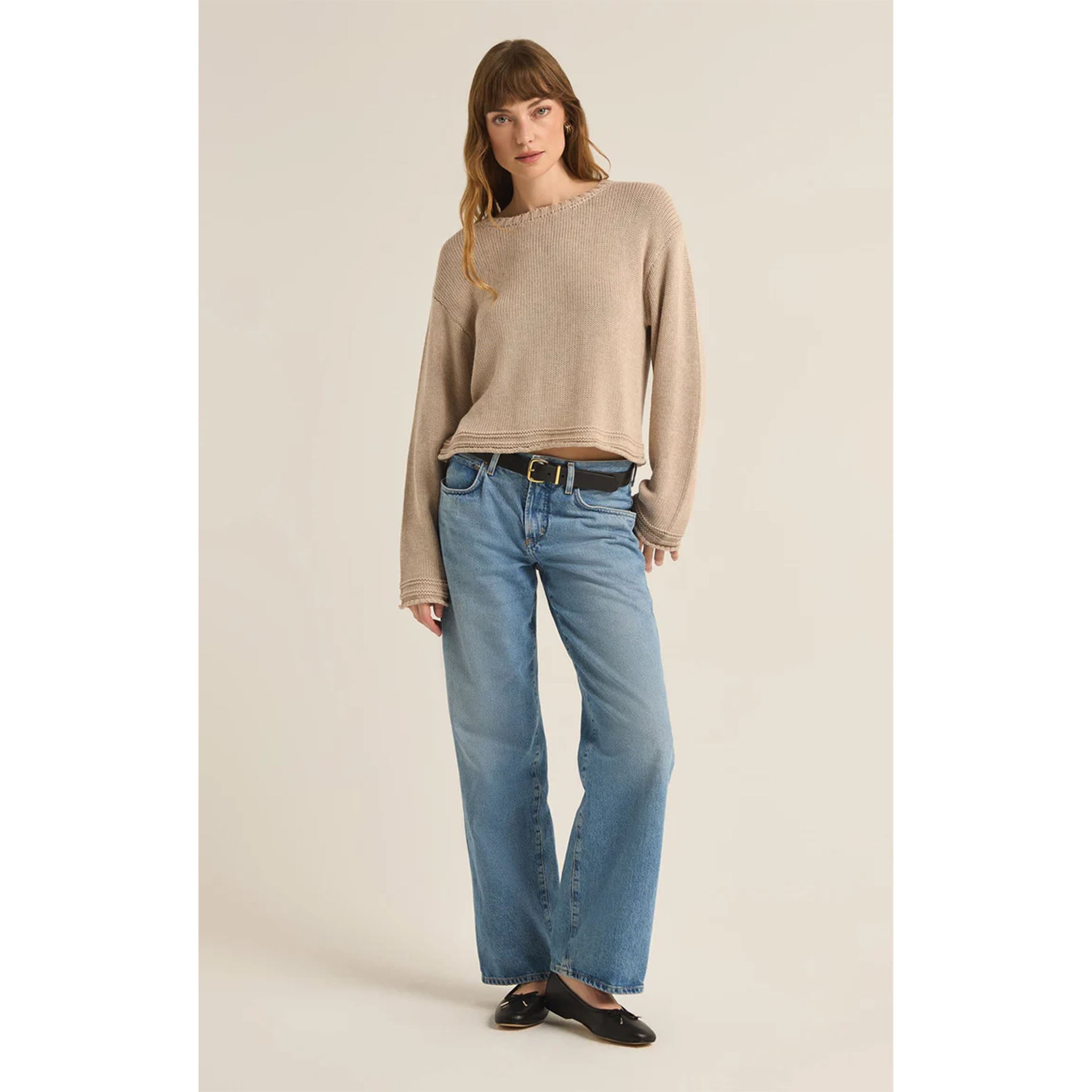 Model wearing wide leg jeans and belt with Z Supply Emerson Sweater in Oatmeal Heather