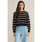 Model wearing Z Supply Estero Stripe Sweater Eclipse with light blue jeans in front of a neutral backdrop