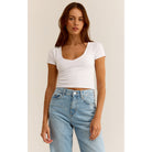  Model wearing Z Supply Kallen Rib Top in White with light blue jeans