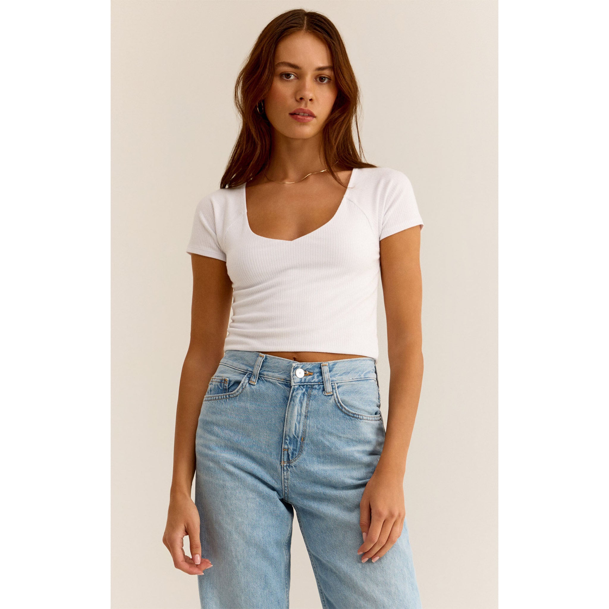  Model wearing Z Supply Kallen Rib Top in White with light blue jeans