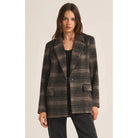 Model wearing Z Supply Kingston Relaxed Plaid Blazer in Latte in front of a neutral background