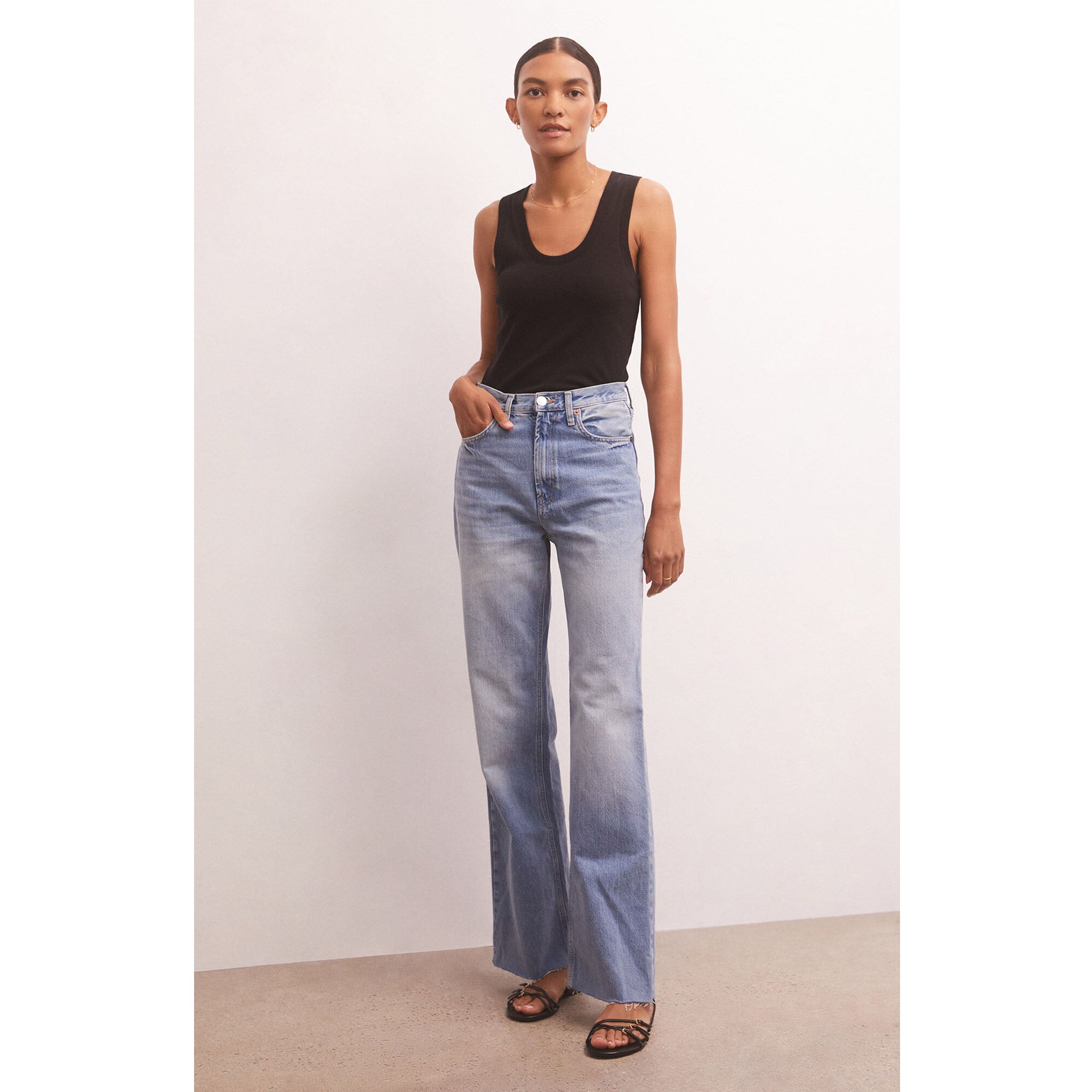 Model wearing wide leg jeans with Z Supply Sirena Rib Tank in Black