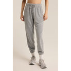 Model wearing Z Supply Unwind Reverse Fleece Jogger in Classic Heather Grey in front of a neutral background