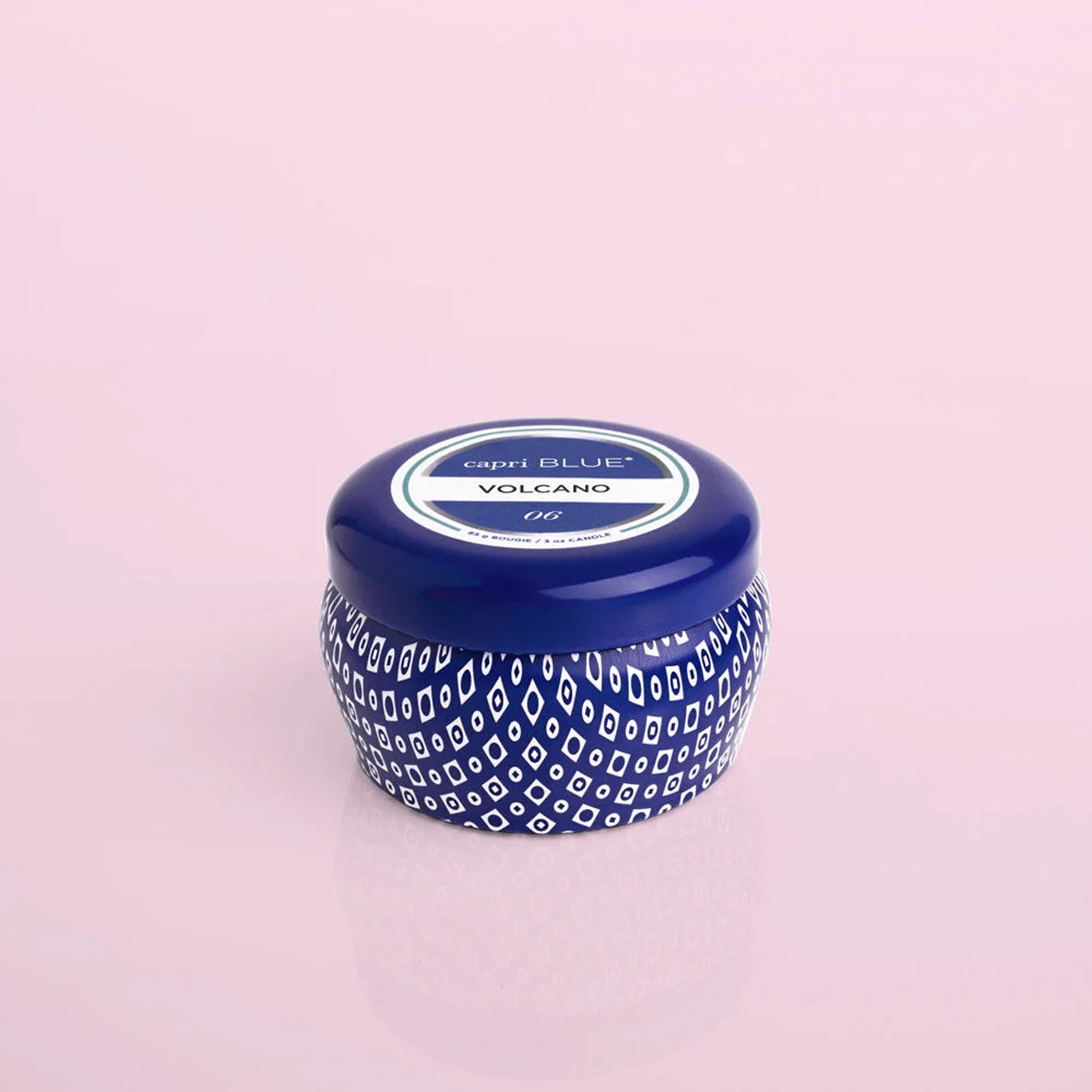 Capri Blue Volcano Signature Blue Mini Tin on a pink background