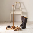 Boot Scraper + Bootjack Stand in a white room at Addison West