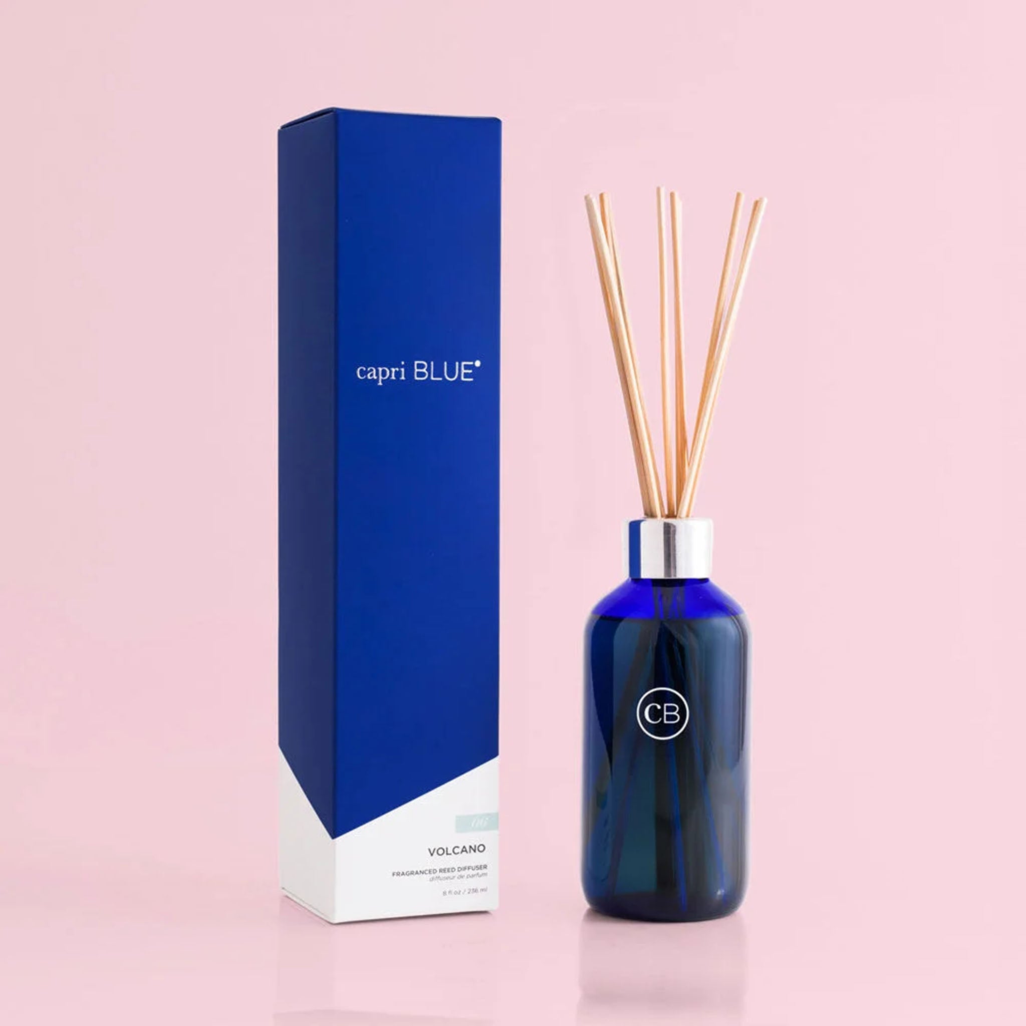 Capri Blue Volcano Reed Signature Diffuser on a pink background