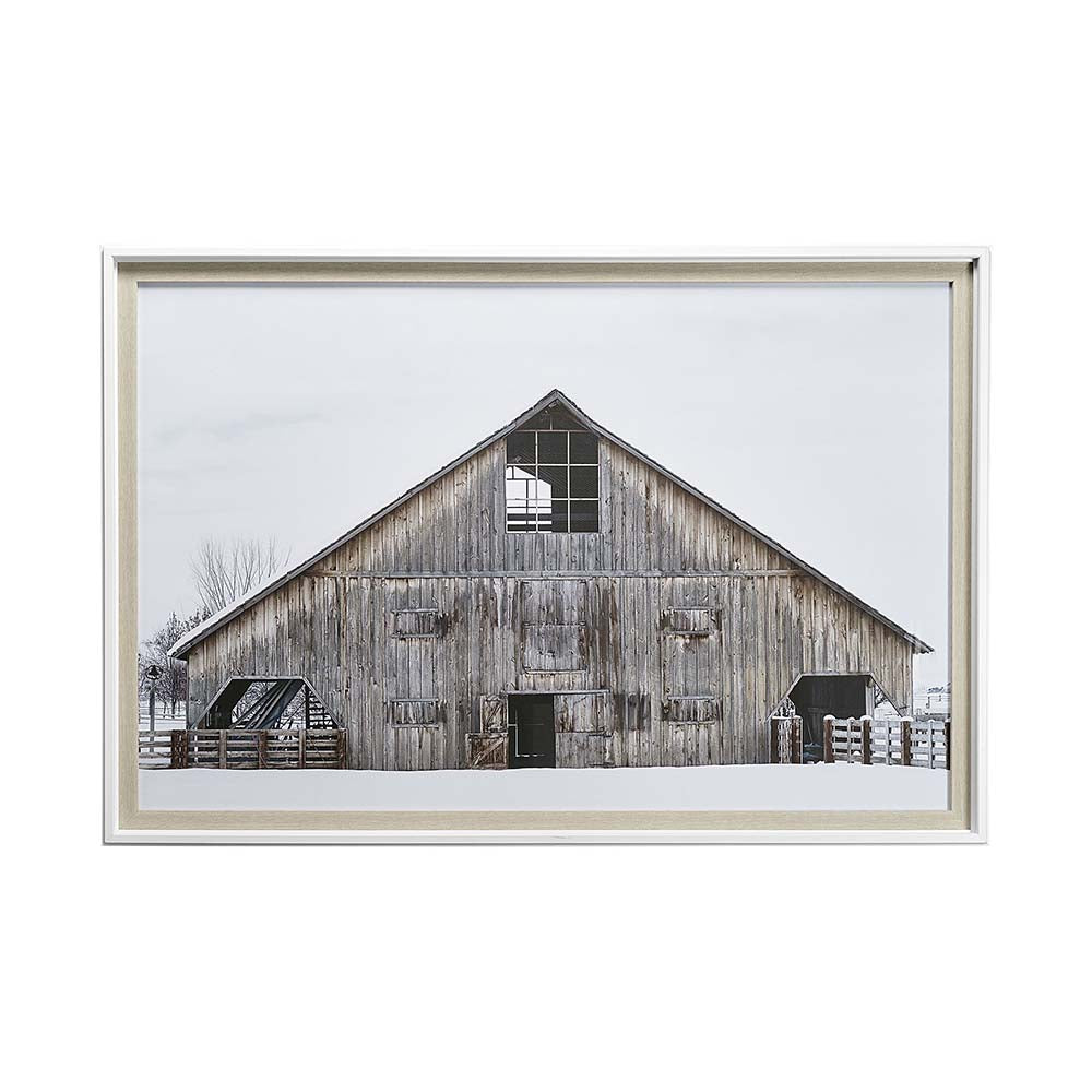 Rustic wood barn in snow framed art print on a white background