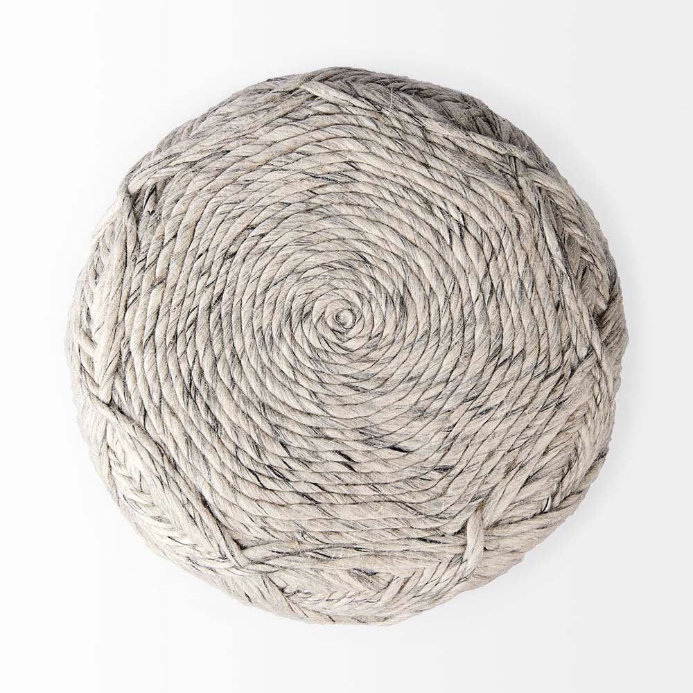 Round pouf covered in woven grey wool in a lattice chevron pattern on a white backrgound