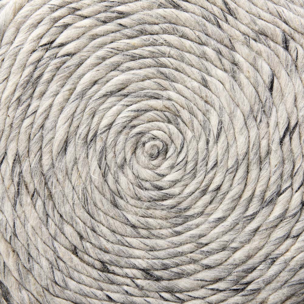 Round pouf covered in woven grey wool in a lattice chevron pattern on a white backrgound