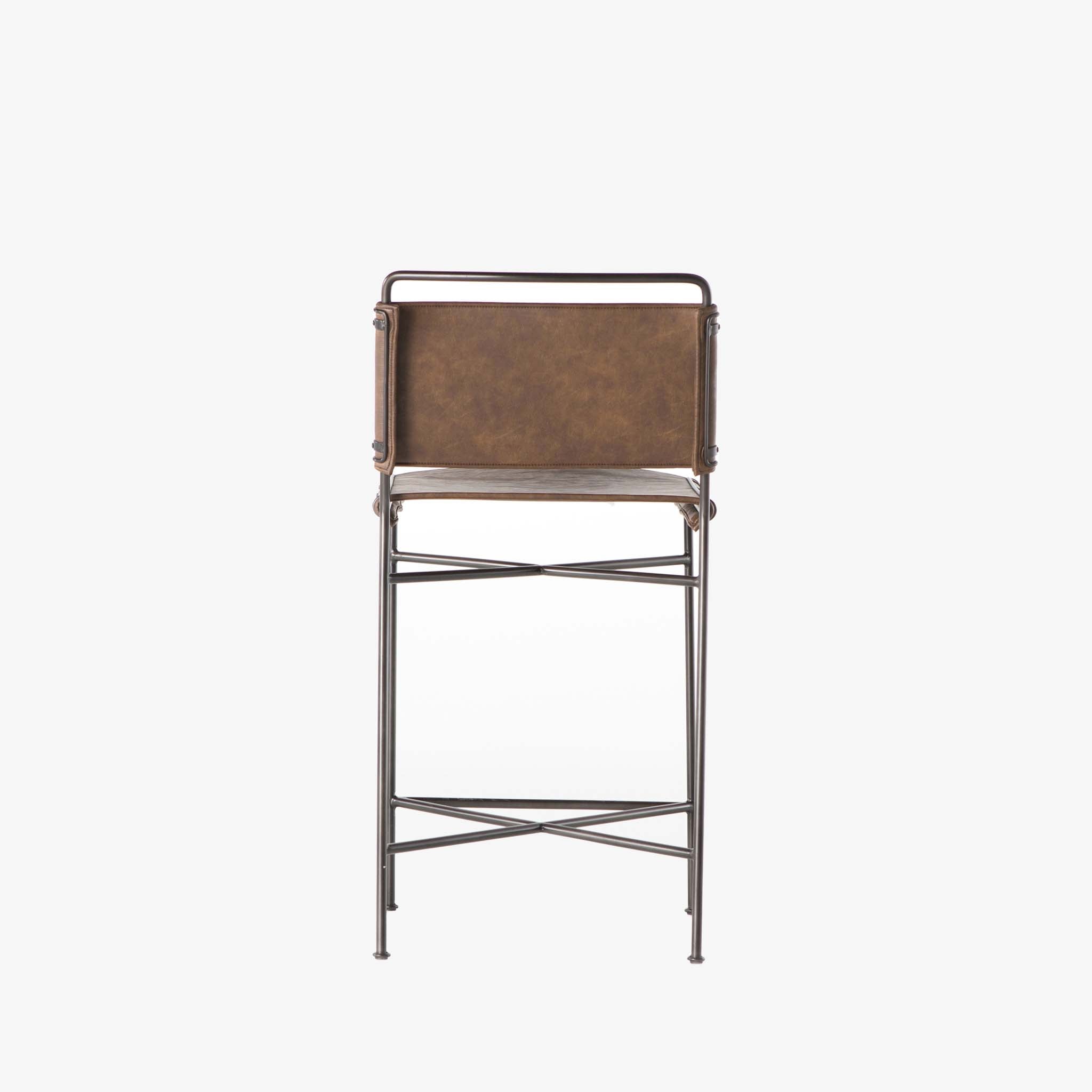 Back view of Four hands brand wharton counter stool with black iron frame and dark brown leather seat on a white background