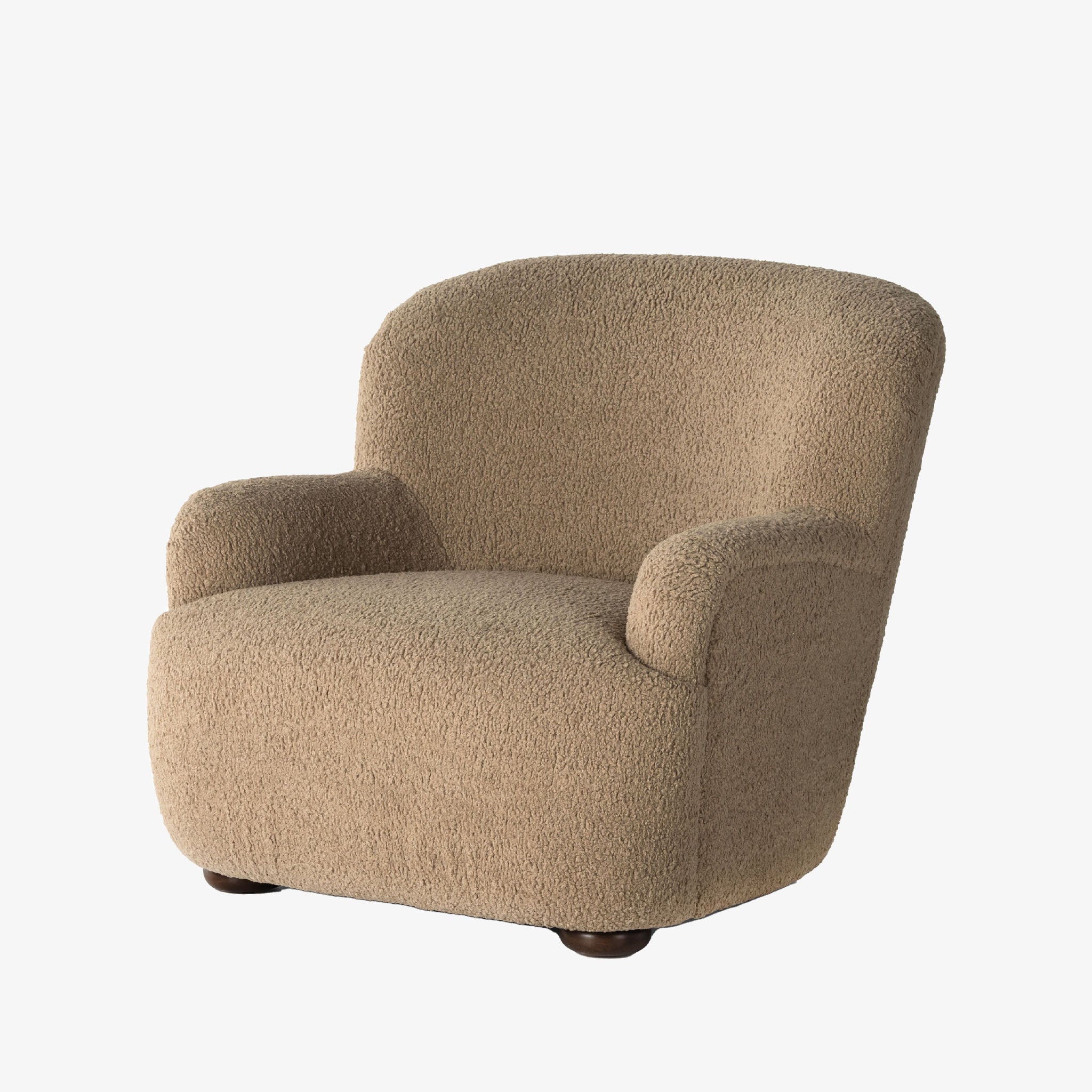 Four hands furniture brand 'Kadon' large armchair with camel color sheepskin style upholstery on a white background