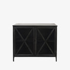 Small black metal cabinet with glass doors and cross hatch mullion design on a white background