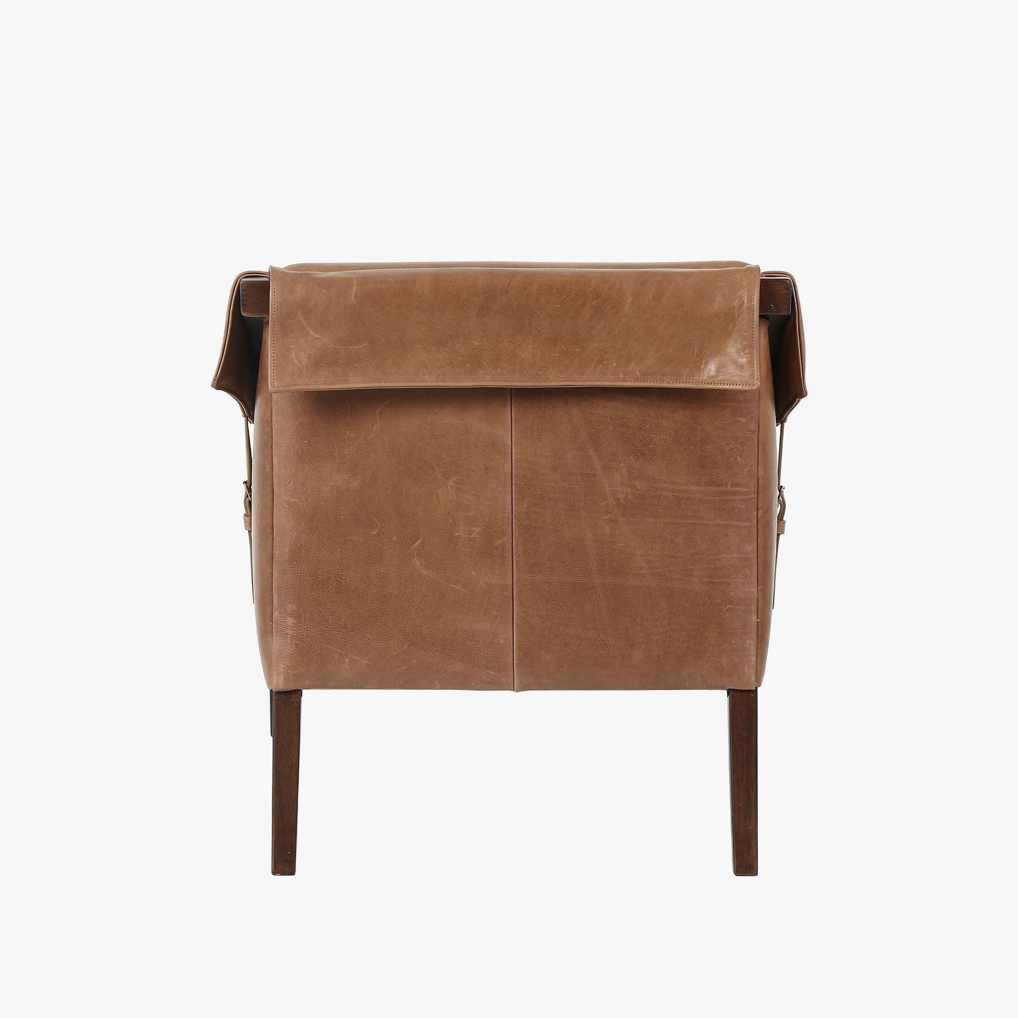 Four Hands Furniture brand Bauer chair in taupe leather with stained wood legs and leather buckled straps on a white background