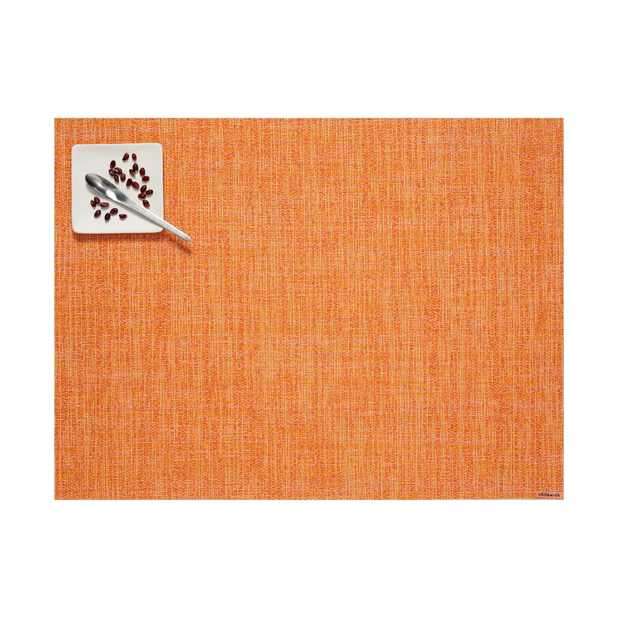 Chilewich boucle rectangle placemat in tangerine orange on a white background