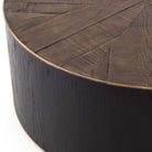 Dark wood 'Perry' coffee table with wood inlay and brass detailing by four hands furniture on a white background