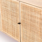 Four Hands furniture brand Carmel side board with four cane doors and metal legs. on a white background