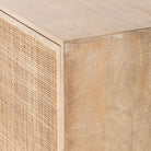 Close up of finish on Four Hands furniture brand Carmel side board with cane doors 