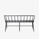 Back view of Black metal bench with Windsor chair styling and curves back rail on a white background