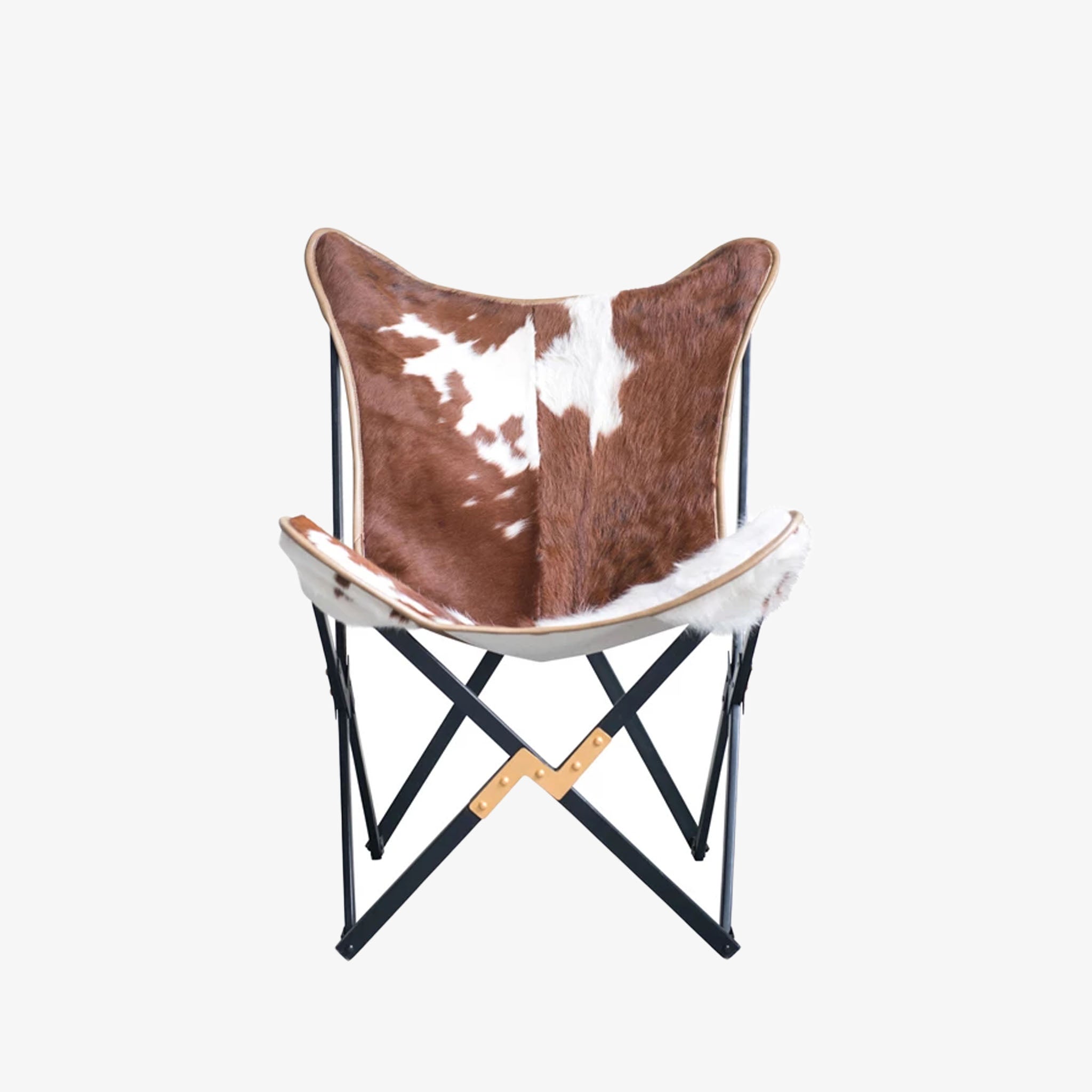 Hand crafted authentic cow hide and metal frame butterfly chair on a white background