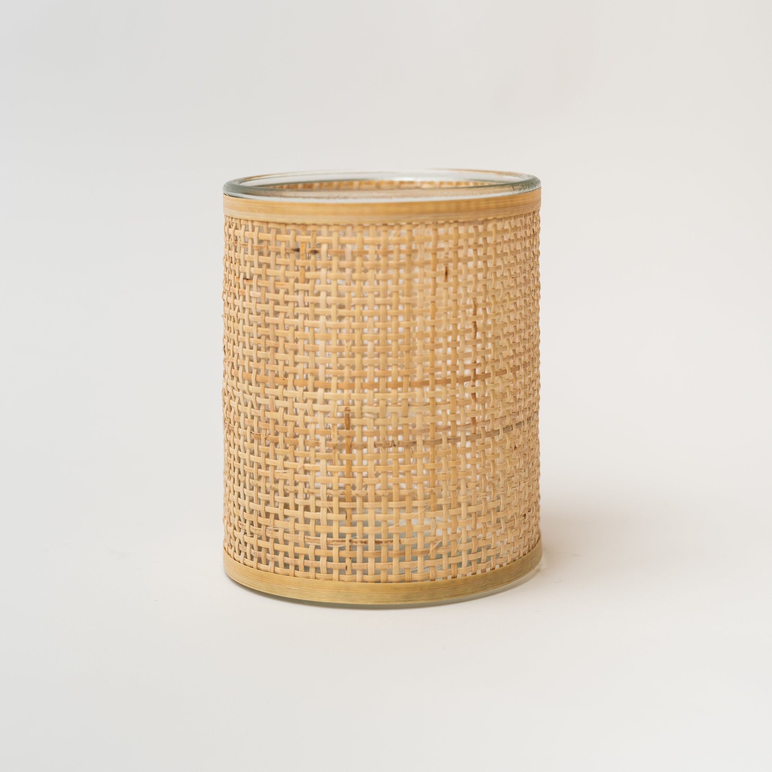 Medium rattan wrapped vase on a white background