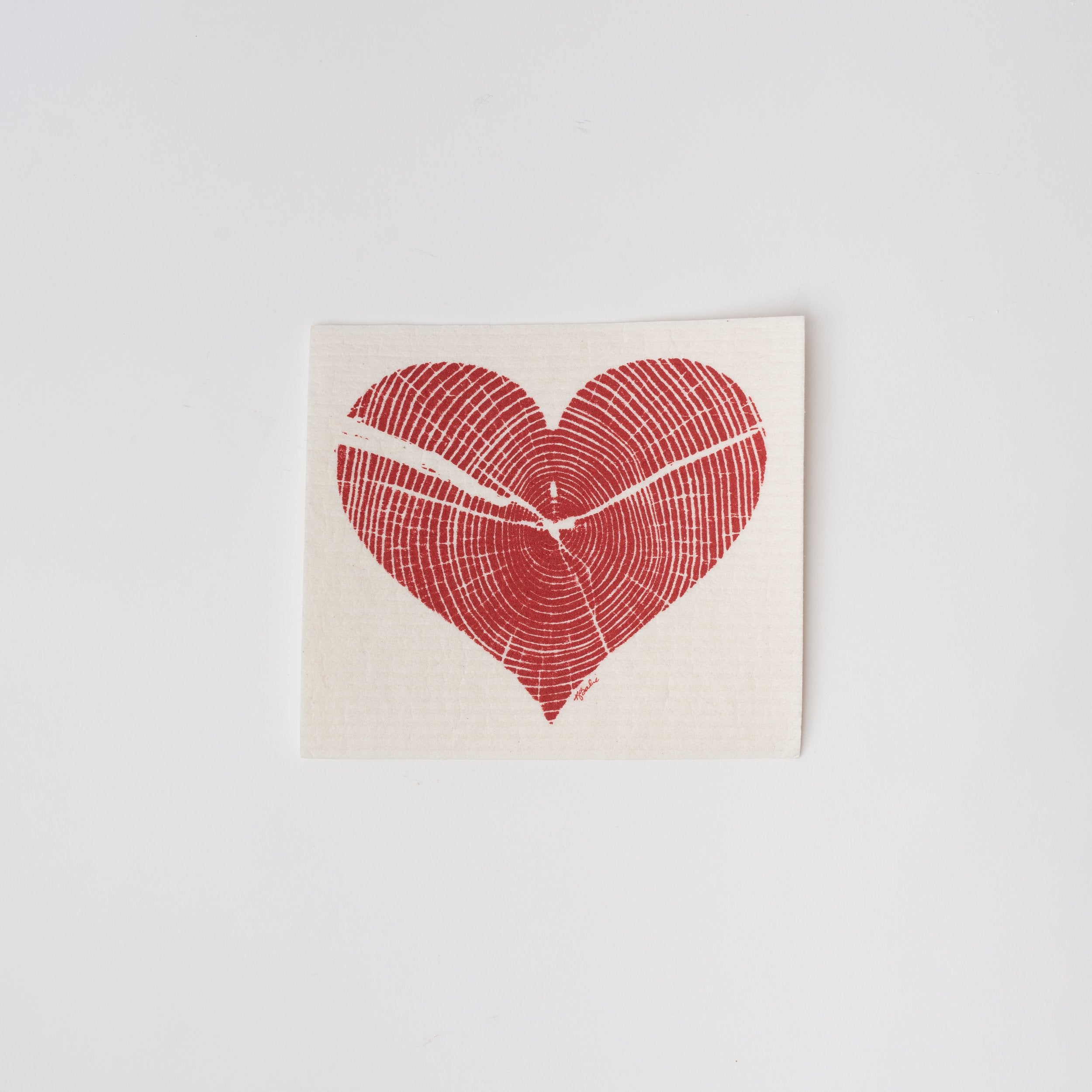 White Swedish cloth with red heart print on a white background