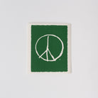 Swedish cloth with Peace sign on green background 