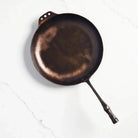 Smithey farmhouse carbon steep skillet on a white background