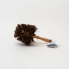 Burstenhaus Redecker flower pot brush on a white background