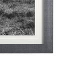 Large black and white barn print in a wood frame on a white background