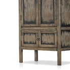 Close up of detail on Tall 'Hitchens' cabinet with worn black paint and two doors on a white background by Four hands furniture