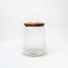 Medium Glass jar with mango wood & marble lid on a white background