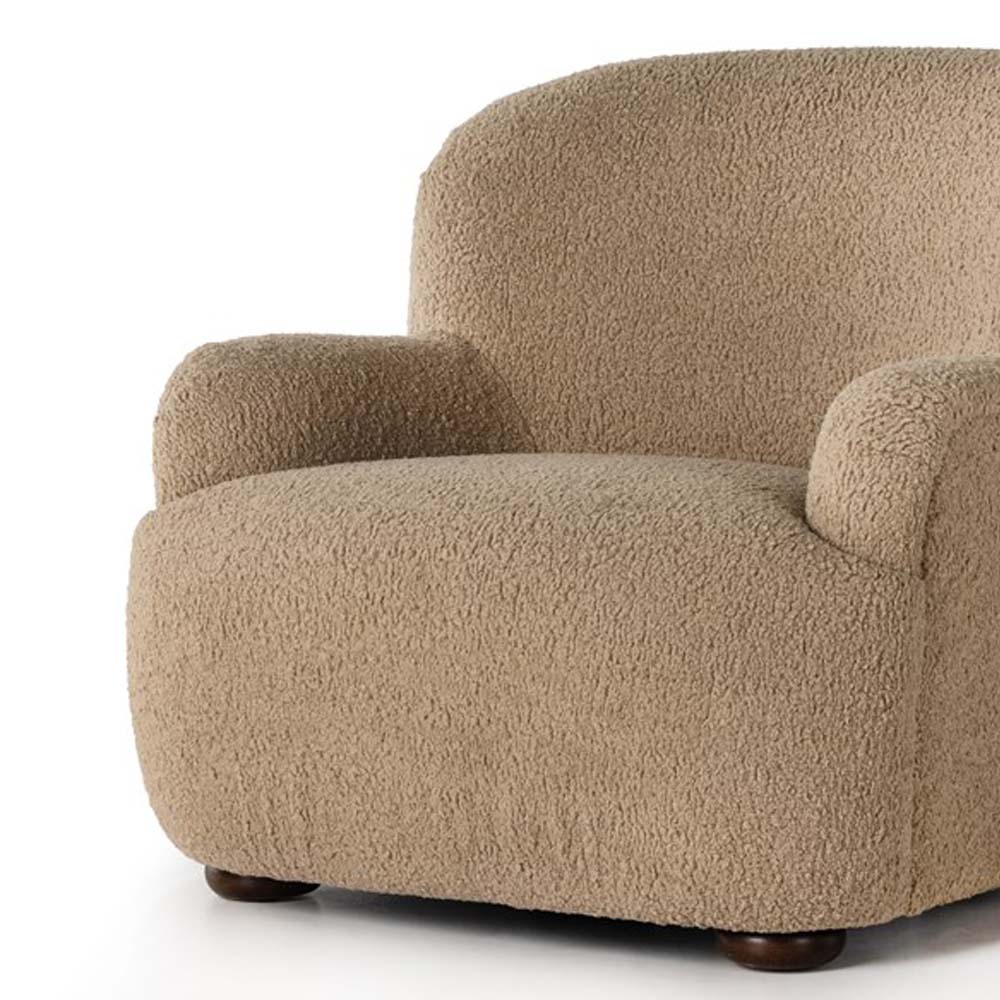 Four hands furniture brand 'Kadon' large armchair with camel color sheepskin style upholstery on a white background