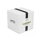 Lafco brand 'sage and walnut' green candle box on a white background