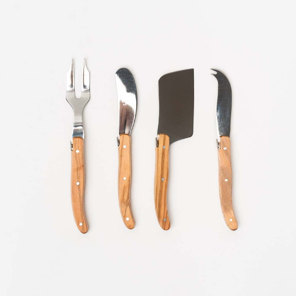 Laguiole olive wood cheese utensils on a white background