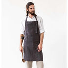 Male model wearing Men's Linen Apron in Charcoal Grey