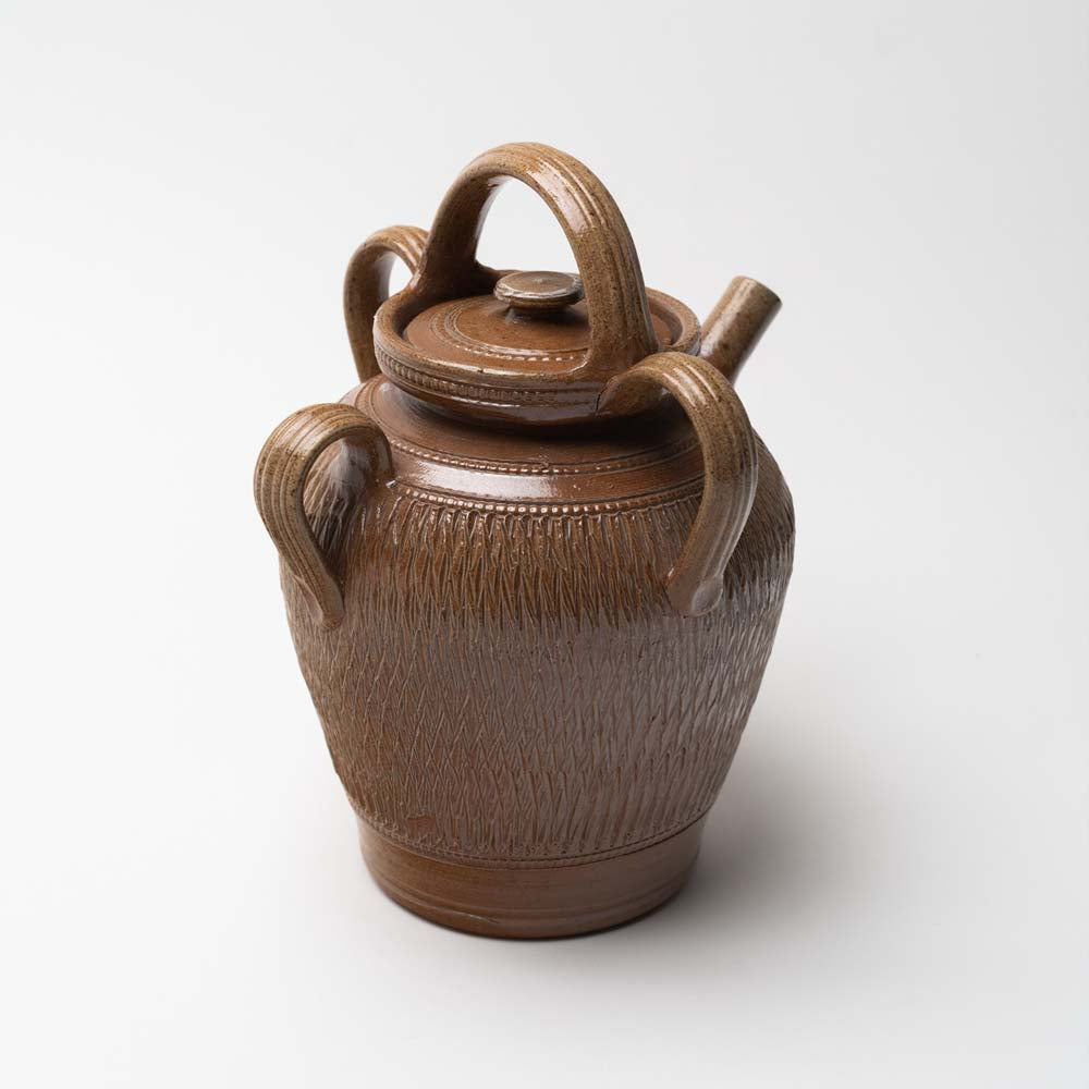 Poterie Renault oil jar with 4 handles and spout on a white background