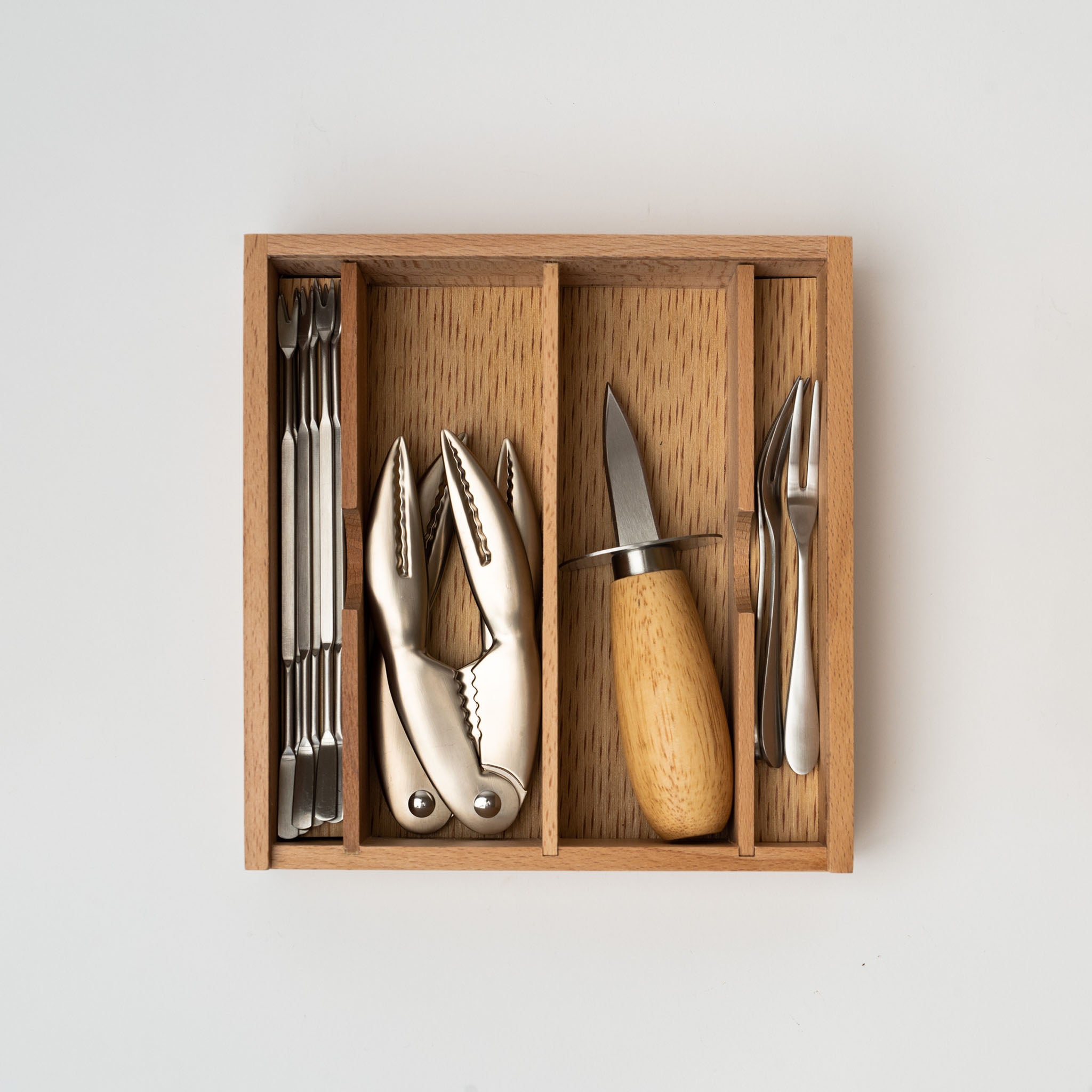 Seafood set in wood box on a white background