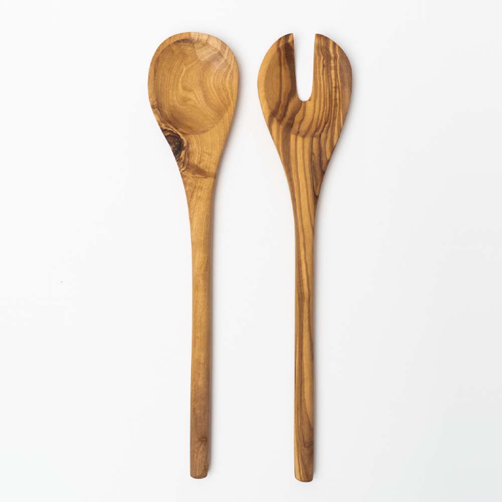 Set of olive wood salad servers on a white background