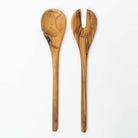 Set of olive wood salad servers on a white background