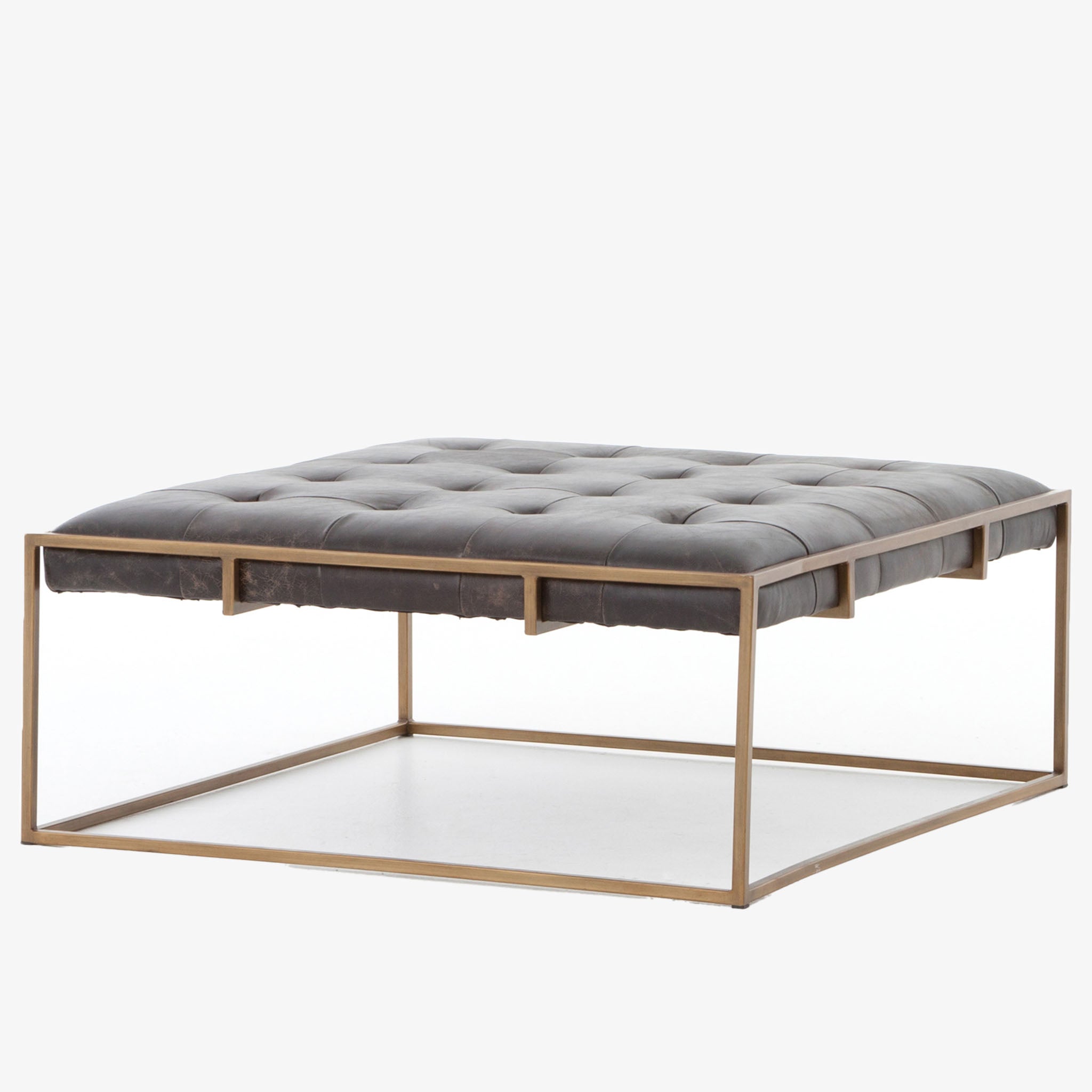 Four hands brand Oxford square coffee table with brass frame and black leather top on a white background