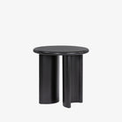 Black end table with two rounded legs by four hands furniture on a white background