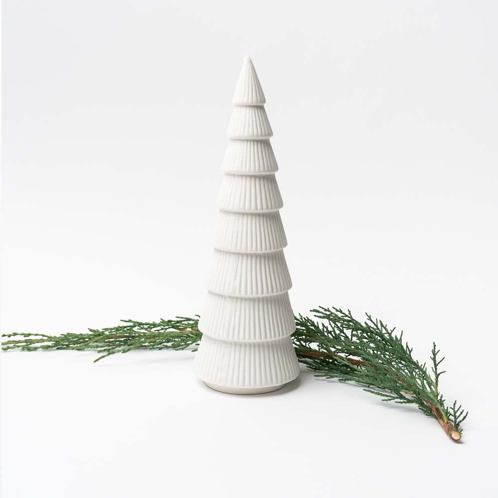 Large White ceramic decorative Christmas tree on white background