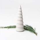 Large White ceramic decorative Christmas tree on white background